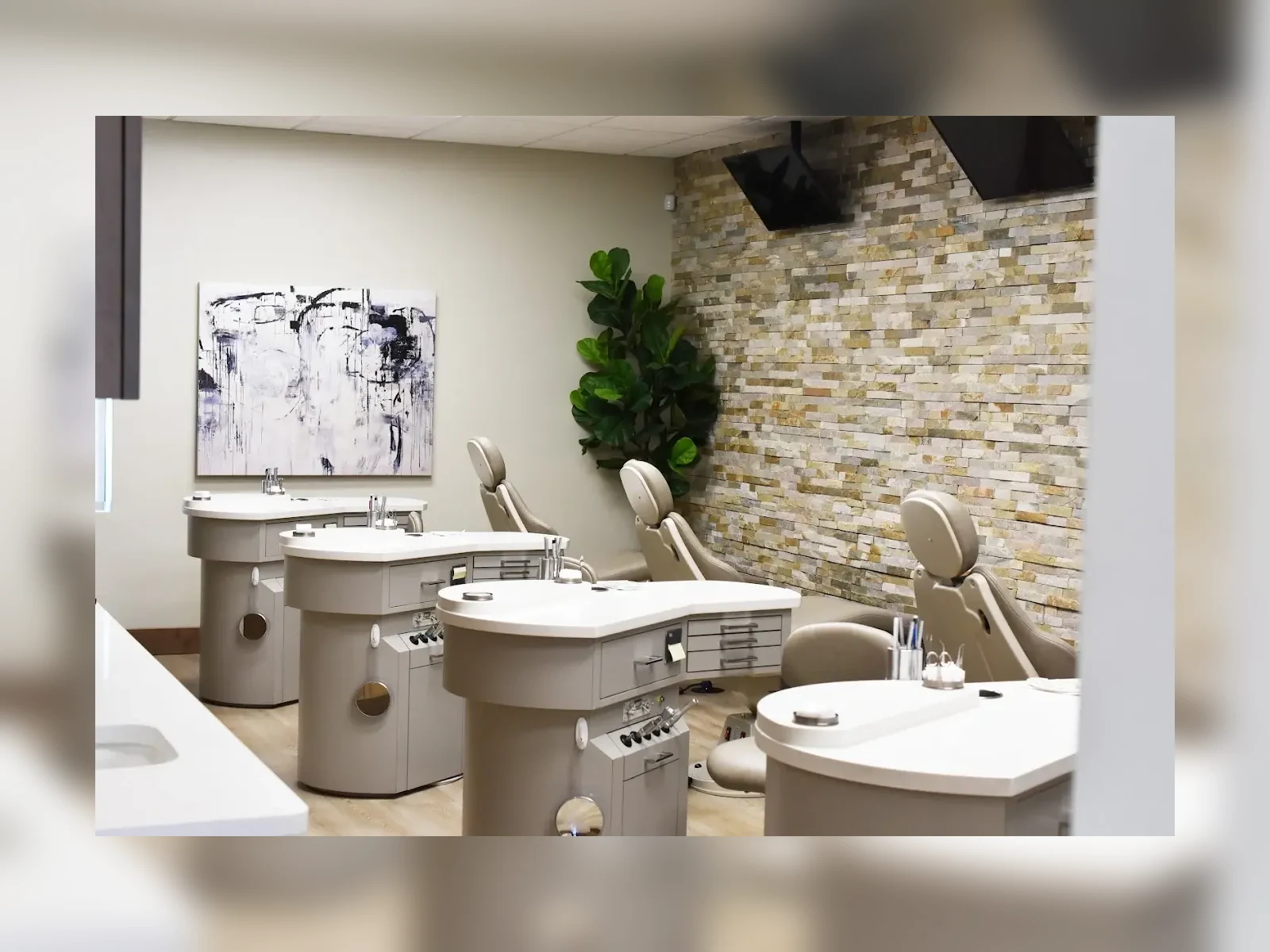 McKay Orthodontics treatment room with orthodontic chairs and stone accent wall
