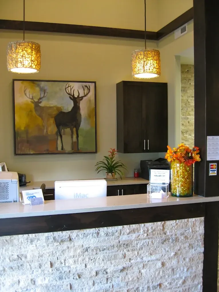 McKay Orthodontics reception desk with warm lighting and artwork