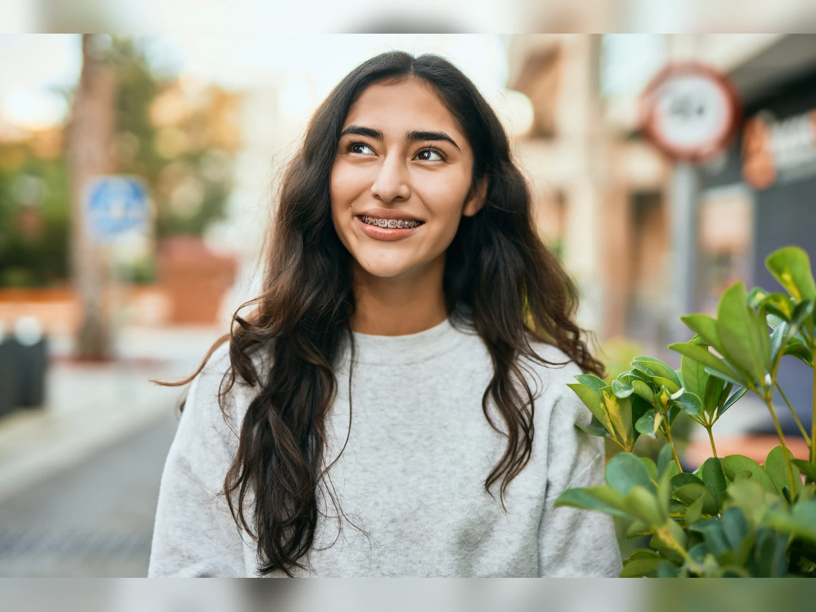 A smiling orthodontic patient with braces
